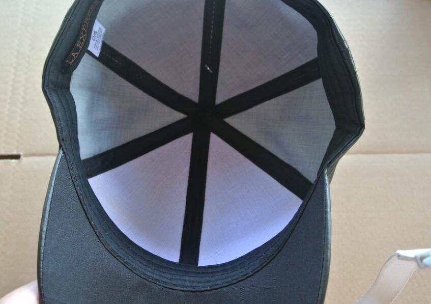 leather cap with pompom
