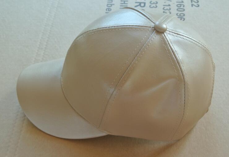leather cap with hairball